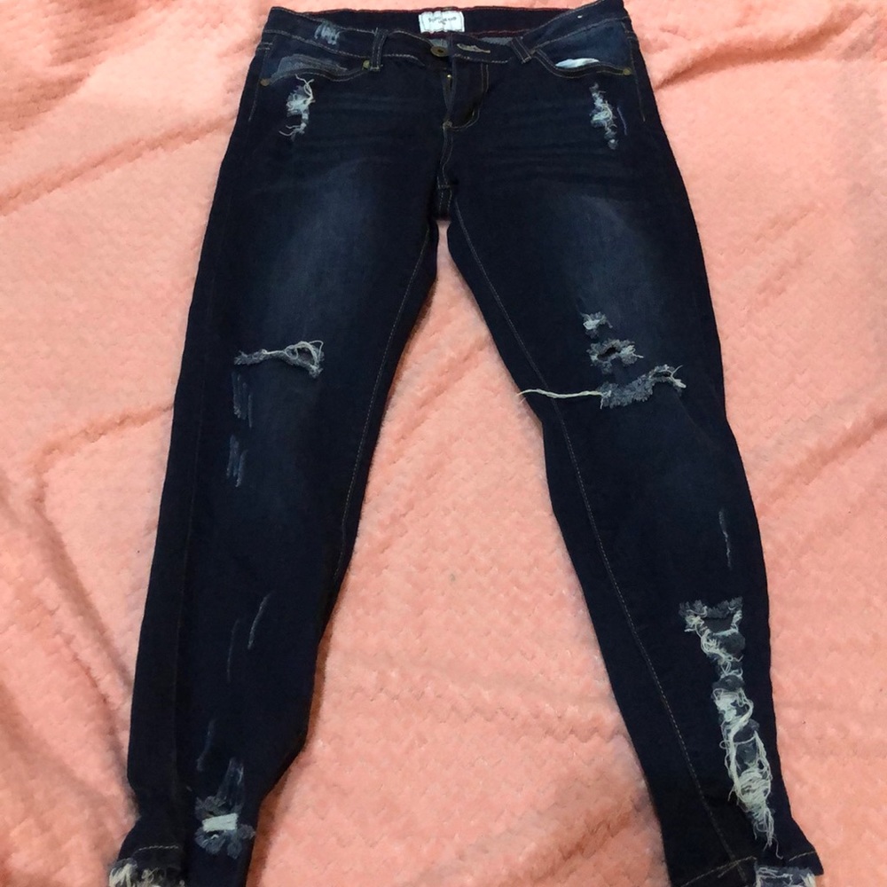 Mid waisted dark denim ripped jeans